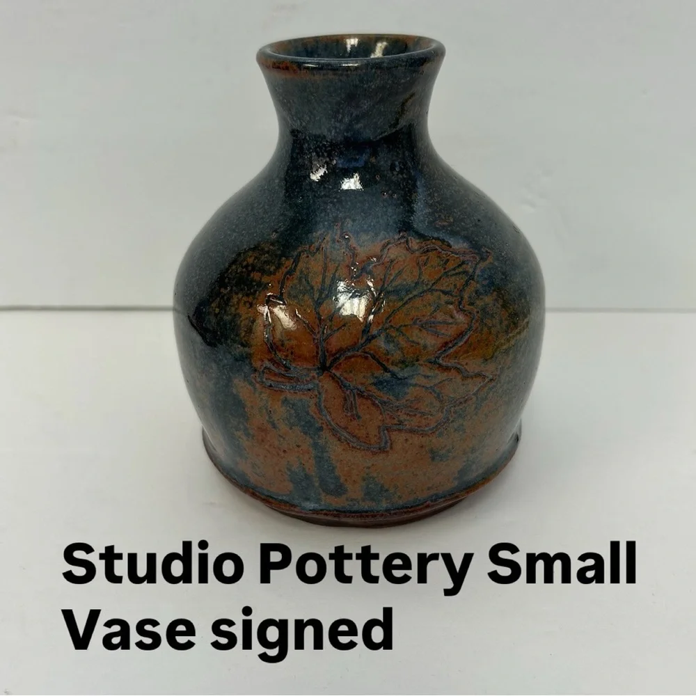 Handmade art pottery vase with a glossy glaze blend of blue and brown/ signed